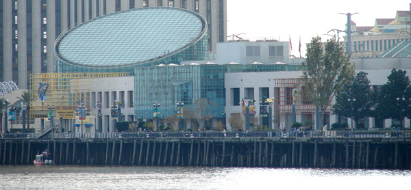 The Audubon Aquarium of the Americas is a renowned aquarium in New Orleans, Louisiana, USA. Recognized as one of the leading aquariums in the United States, the Aquarium of the Americas is run by the Audubon Institute, which also supervises the Audubon Zoo and Audubon Park (in a different part of the city). The Aquarium is located along the banks of the Mississippi River by the edge of the historic French Quarter off Canal Street and opened in 1990.  With 10,000 animals representing 530 species, exhibits include the Mississippi River gallery, featuring catfish, paddlefish, and alligators; a Caribbean reef exhibit featuring a clear, 30-foot-long tunnel surrounded by aquatic creatures; and a Gulf of Mexico exhibit featuring sharks, sea turtles, and stingrays.  The Aquarium of the Americas also hosts an IMAX theater.